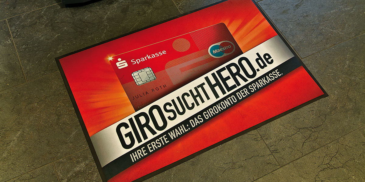 Ad-Mat Floormat - custom mat advertising Sparkasse "Giro sucht Hero" banking services