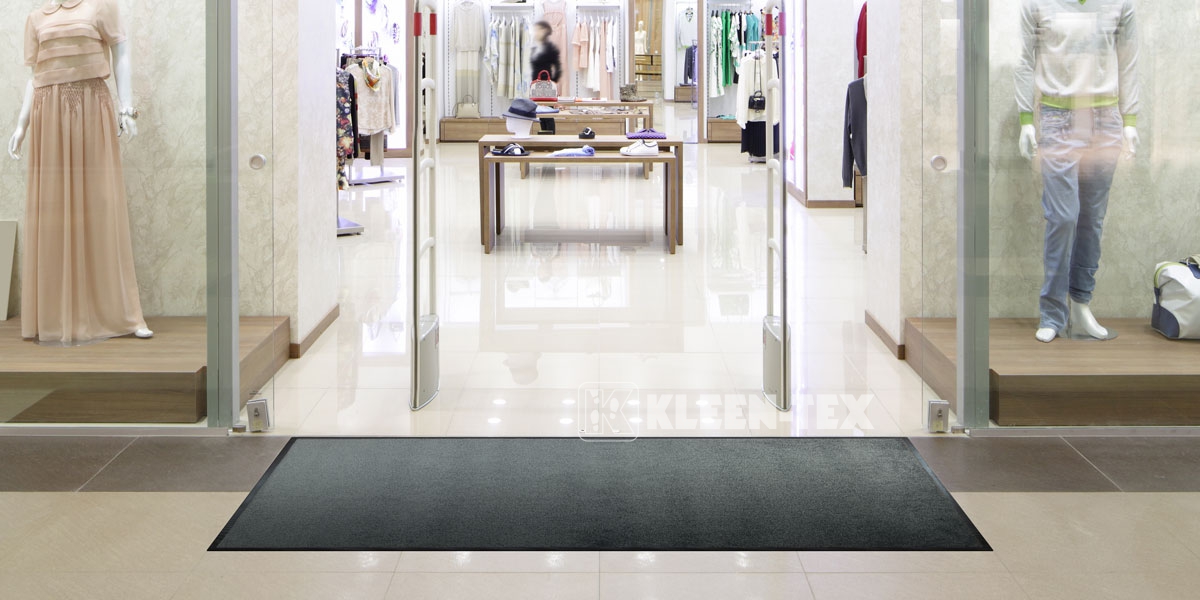 Monotone mat in front of shop entrance